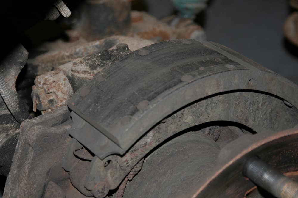 A closer view of the metal brake shoe and the resin brake lining.